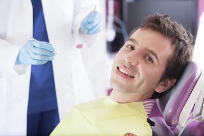 man smiling in dental chair in anderson sc