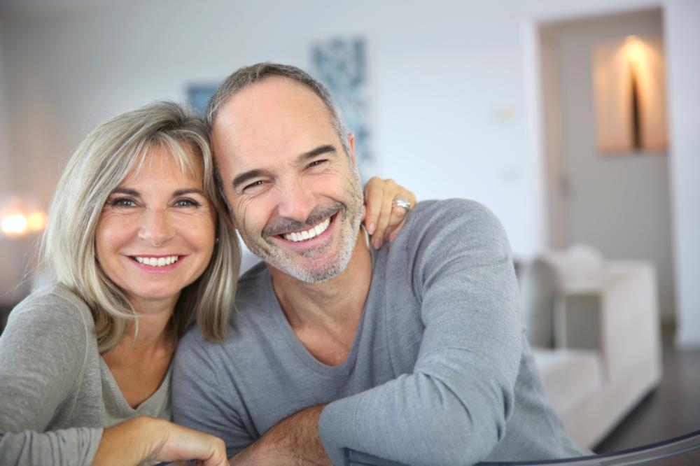 middle-aged man and woman smiling