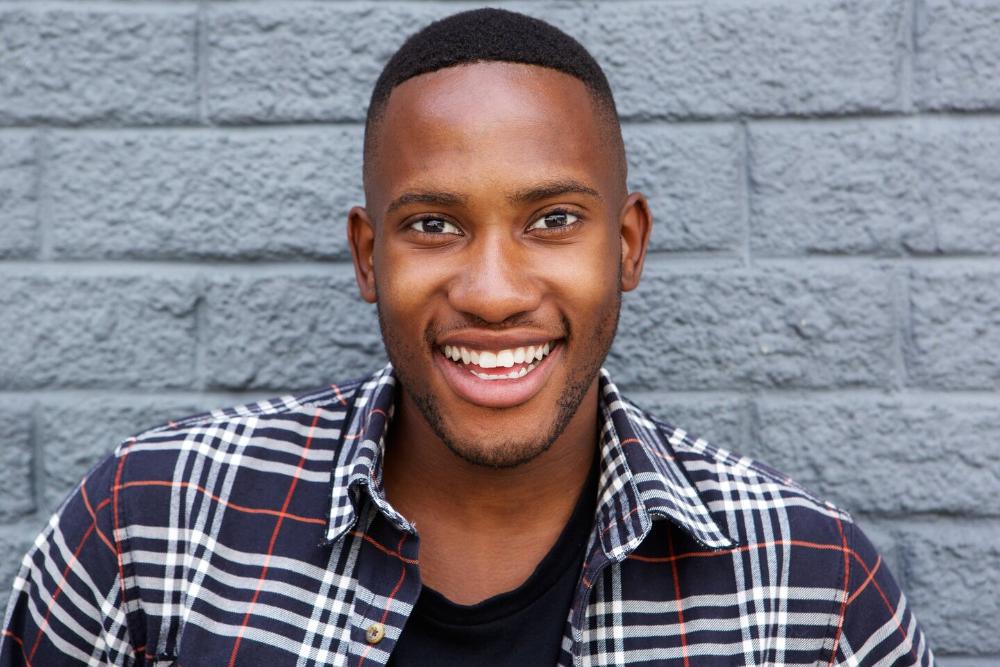 Anderson man smiling after getting dental crowns