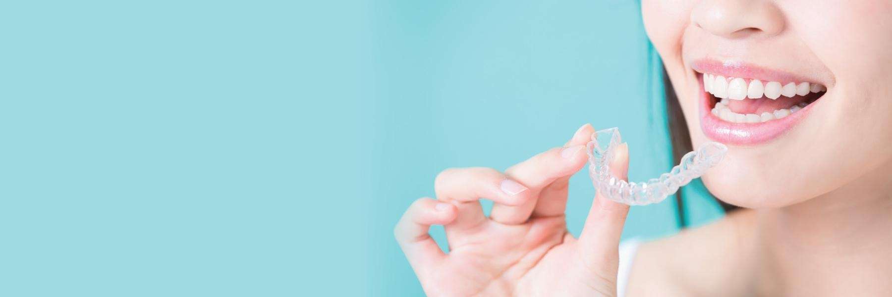 woman using clear aligners in anderson sc